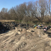 В Киеве зафиксировали «захоронения» покрышек: тонны резины трактор засыпает песком