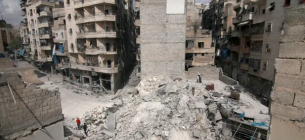 Руйнування після застосування бочкових бомб сирійською армією в житловому районі підконтрольного опозиції районі Сукері в Алеппо, 2016 рік. Фото: Anadolu Agency/Getty Images